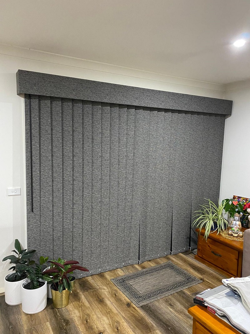 Pelmet installed over vertical blinds with slats closed showing matching blind fabric and pelmet fabric